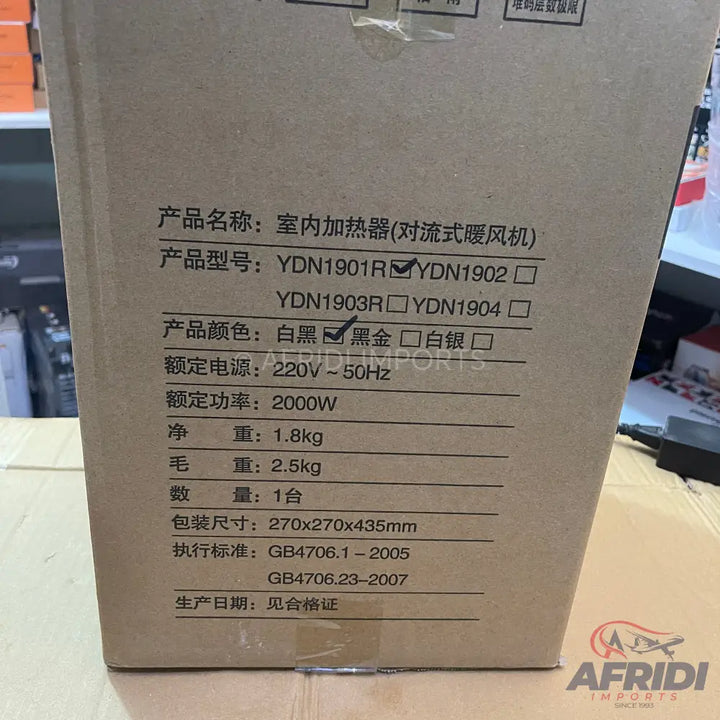 Cardboard box containing a 2000W indoor convection heater, model YDN1902, in black, with a net weight of 1.8kg and gross weight of 2.5kg.