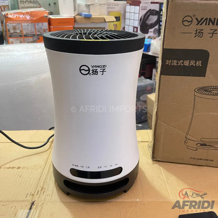 White and black electric convection heater with top-mounted air outlet.