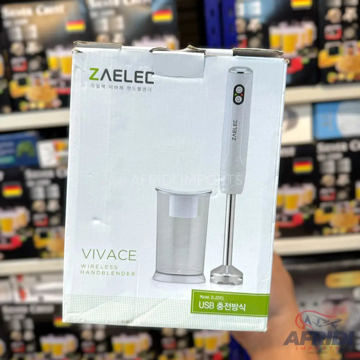 White ZAELEC Vivace wireless hand blender with a clear measuring cup, featuring two control buttons and a USB charging method.