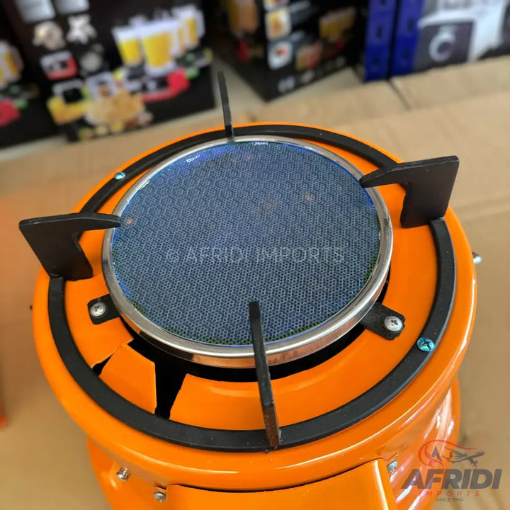 Orange portable gas stove with a blue ceramic burner.