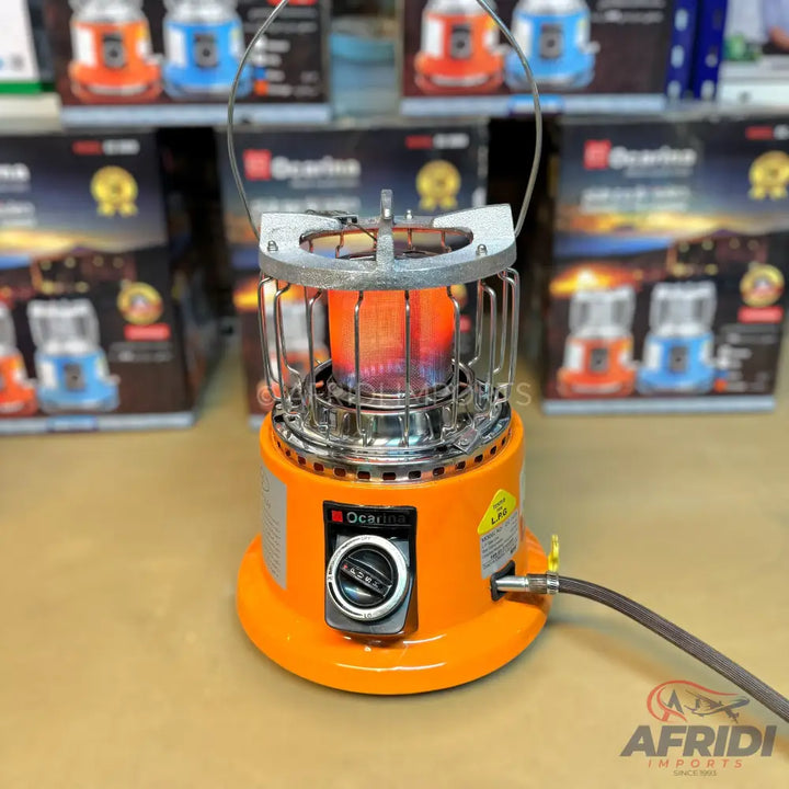 Orange portable gas heater with a chrome-plated cage and active flame.