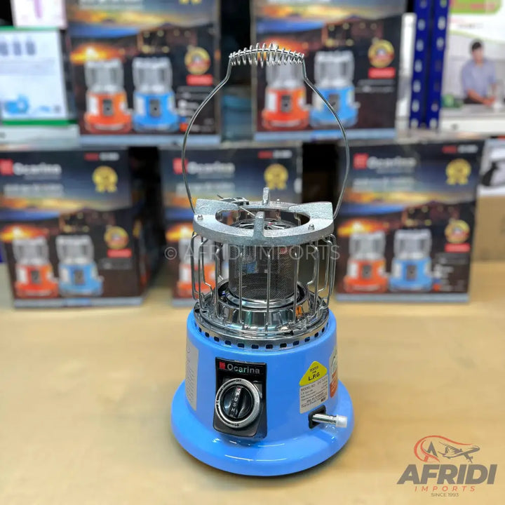 A blue portable gas stove with a metal grill top and a control knob.