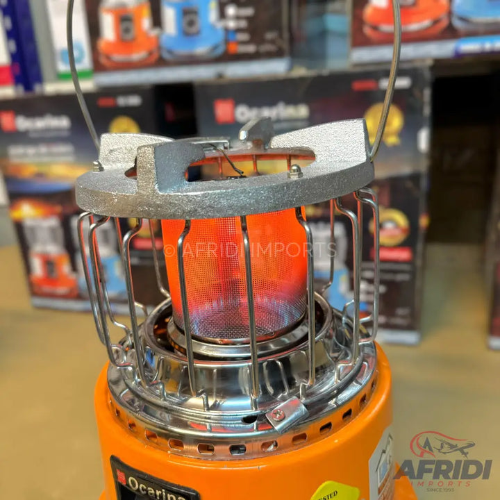 An orange portable gas heater with a glowing red heating element.