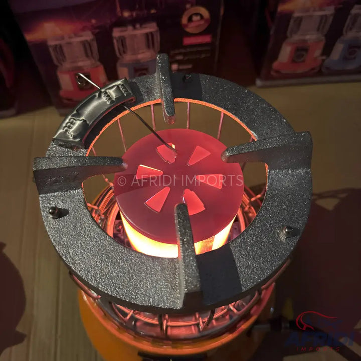 A portable, lit gas heater with a dark metal grate.