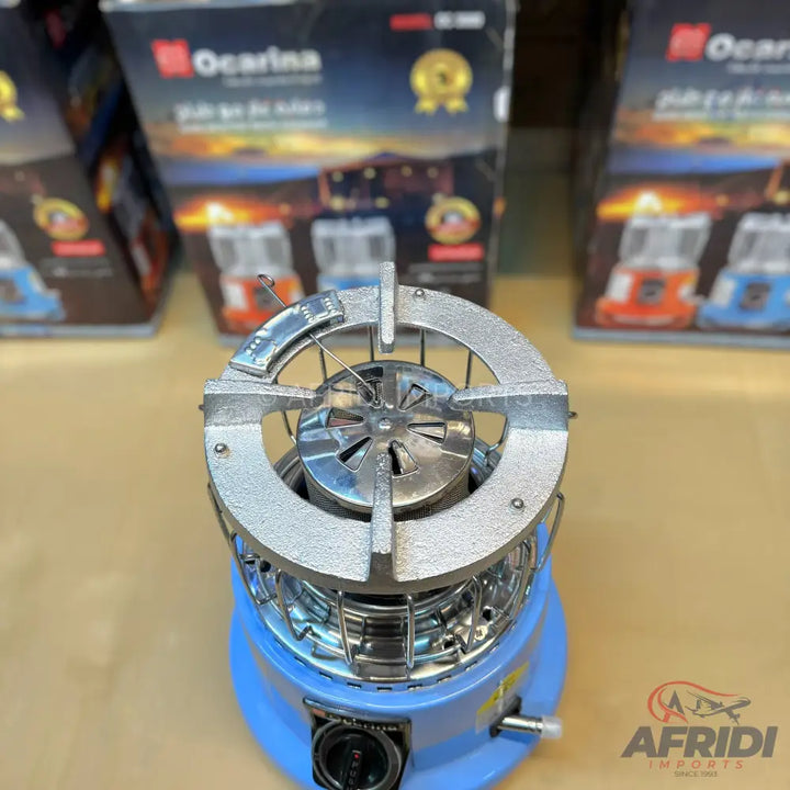 A portable blue and silver gas stove with a single burner.