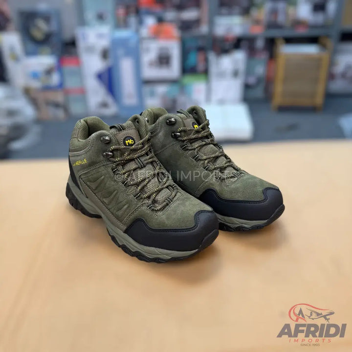 A pair of olive green hiking boots with black soles and yellow accents.