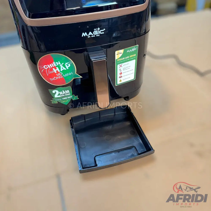 Black and copper air fryer with a removable drip tray.