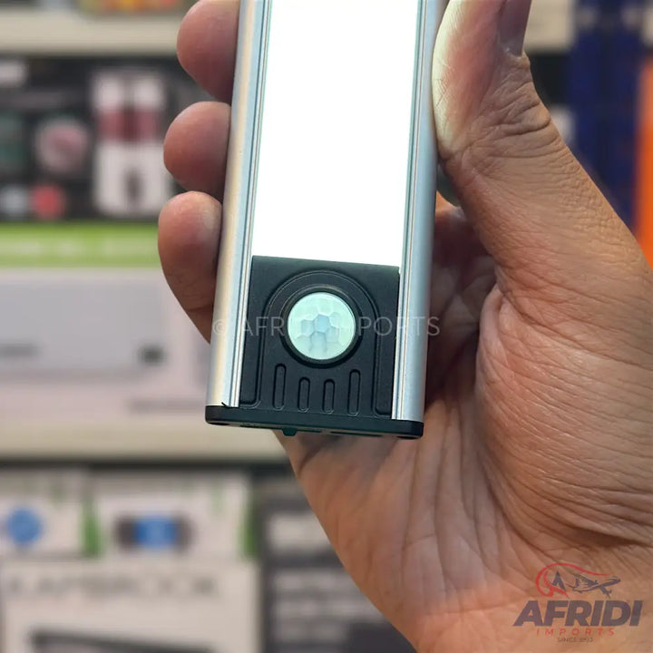 A silver and black motion-sensing LED light bar.