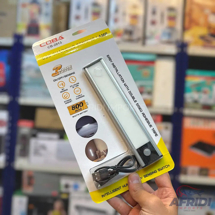 A white LED motion-sensing light bar with an 800 mAh built-in battery and a USB charging cable, packaged for retail.