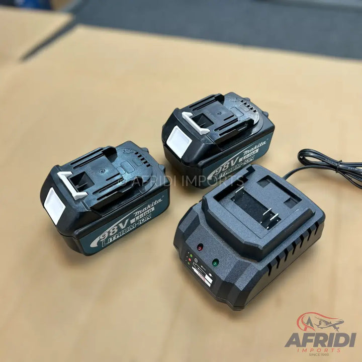 A set of two black power tool batteries and a matching battery charger.