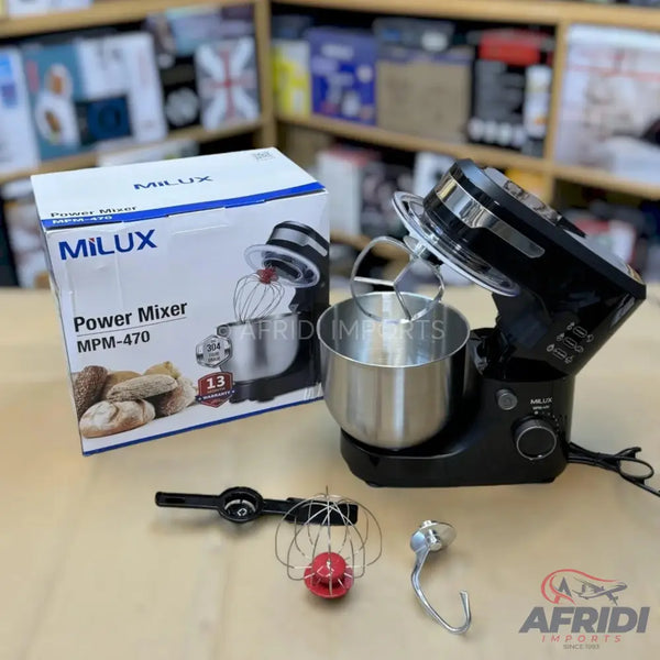 Black stand mixer with stainless steel bowl and various attachments, including a whisk and dough hook.