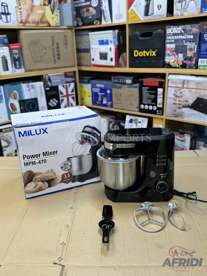 Black stand mixer with a stainless steel bowl and various attachments.