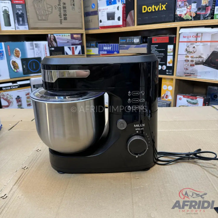 Black stand mixer with a stainless steel bowl and a speed control dial.