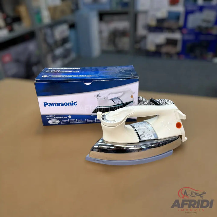 A Panasonic dry iron with a white handle and a shiny chrome soleplate.
