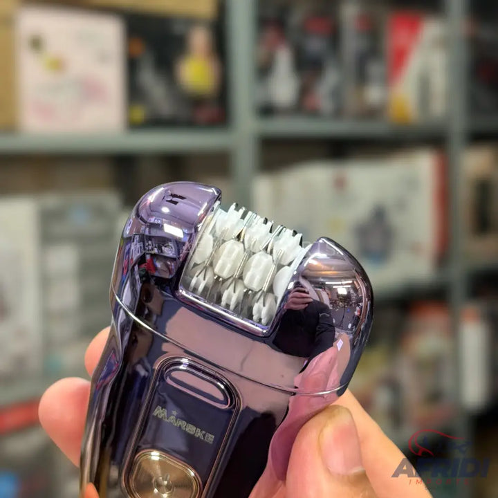 A shiny purple electric epilator with a visible rotating head of tweezers.