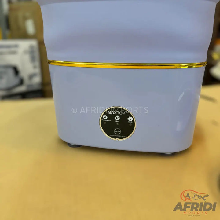 Light purple foldable washing machine with a gold accent band.