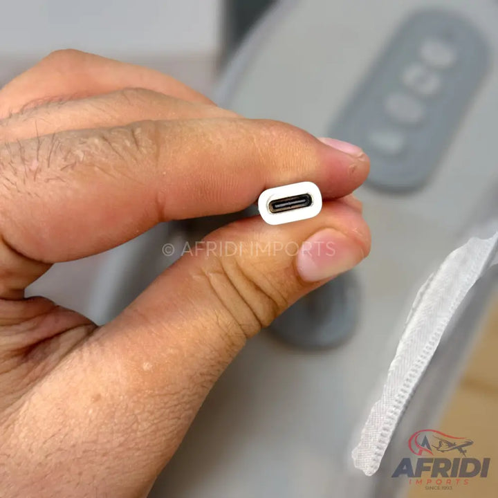 A white USB-C female to USB-C female adapter.