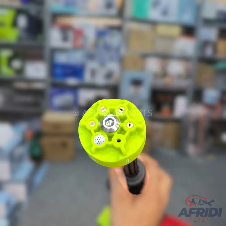 Handheld lime green multi-pattern spray nozzle.
