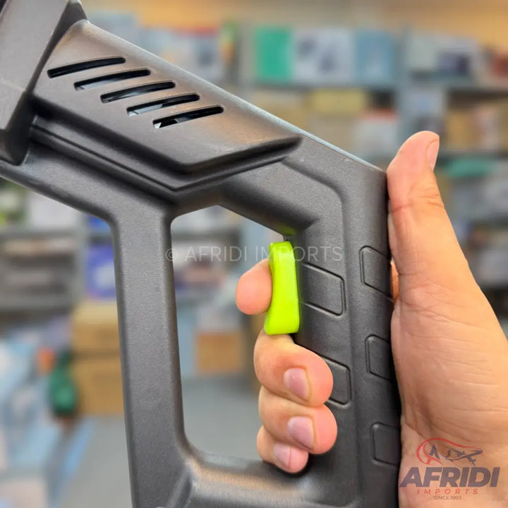 Black plastic grip with a bright green trigger.
