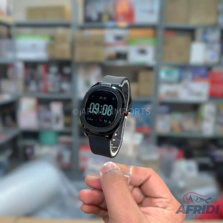 Black smart watch with an oval face and a black silicone strap, displaying 09:08.