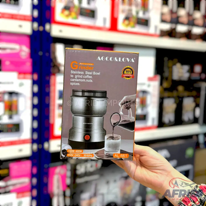 A boxed electric grinder with a stainless steel bowl for coffee, cardamom, nuts, and spices.