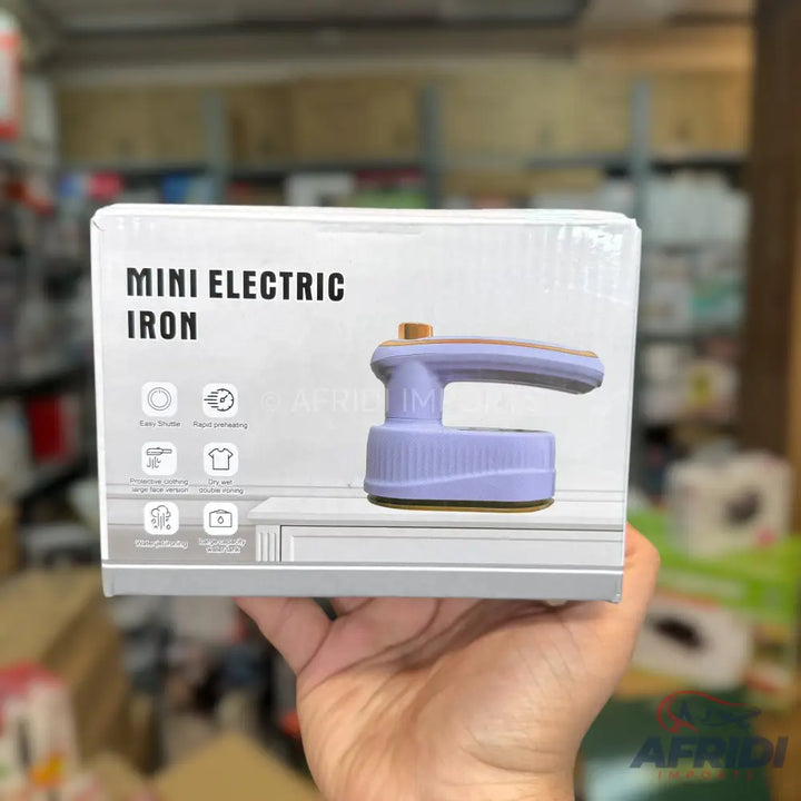 Mini electric iron in a box with product features.