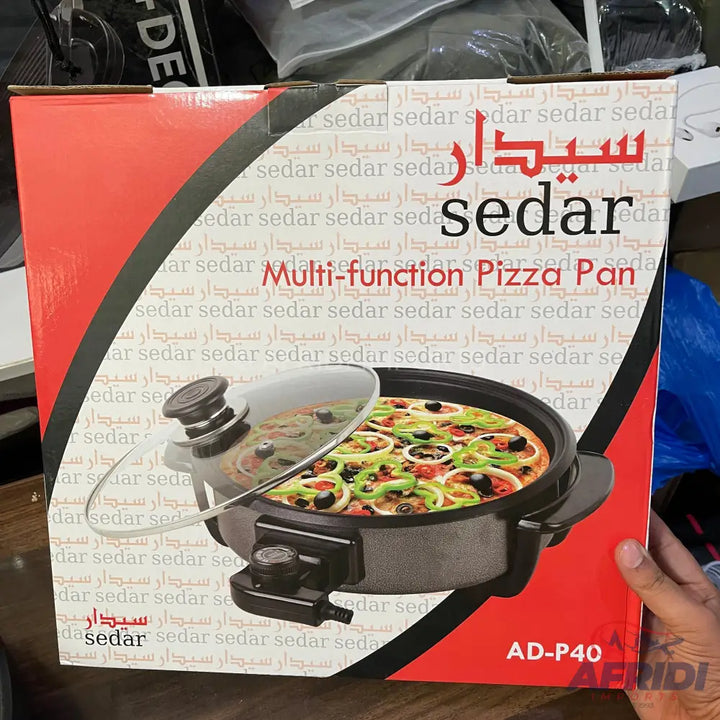 Packaged multi-function pizza pan with a clear lid.