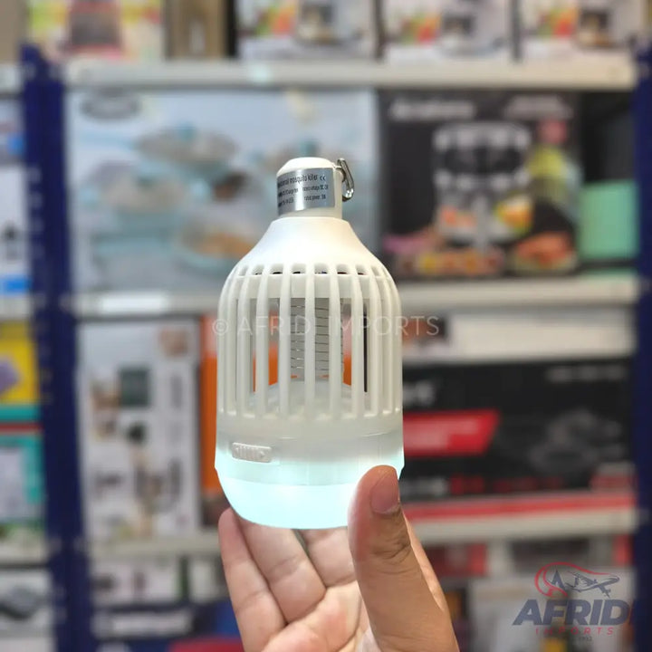 A white, portable, rechargeable LED light bulb with a protective cage, suitable for outdoor use.