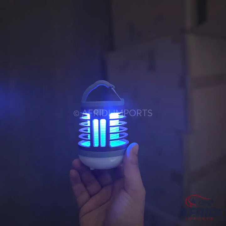 Portable blue light insect killer with a hanging handle.