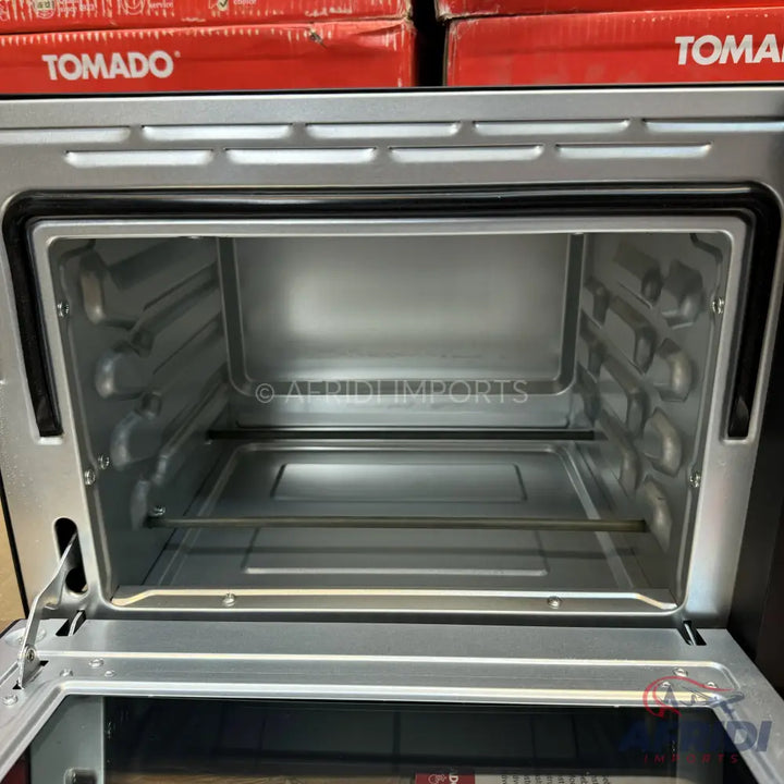 An empty, stainless steel electric oven with a glass door.