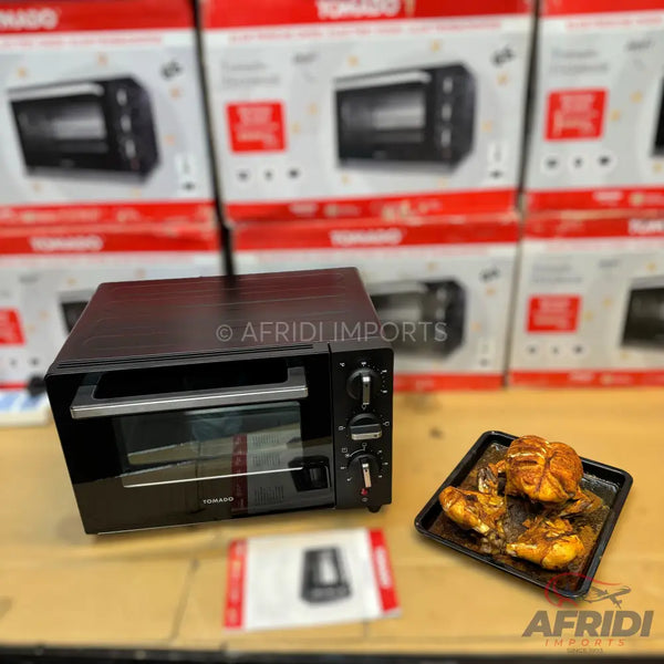 Black countertop toaster oven with a clear glass door and three control knobs.