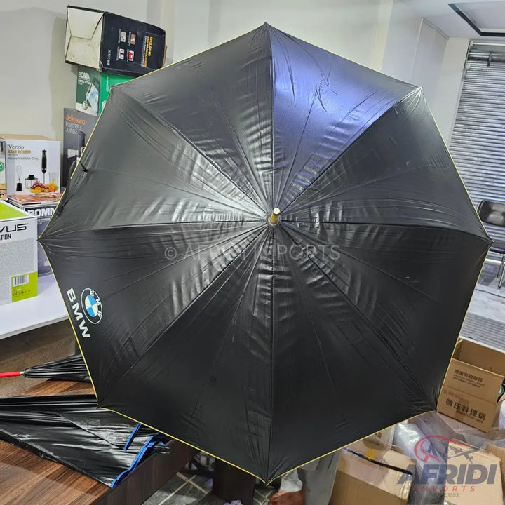 Black umbrella with a yellow trim and BMW logo