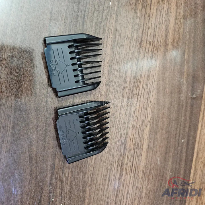 Two black hair clipper guards.
