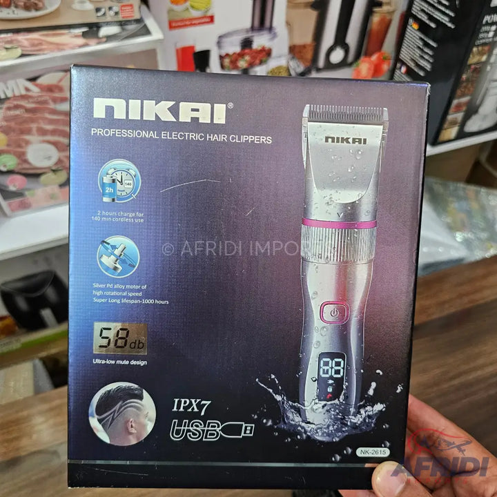 A boxed Nikai professional electric hair clipper with a digital display, USB charging, IPX7 waterproof rating, and ultra-low noise design.