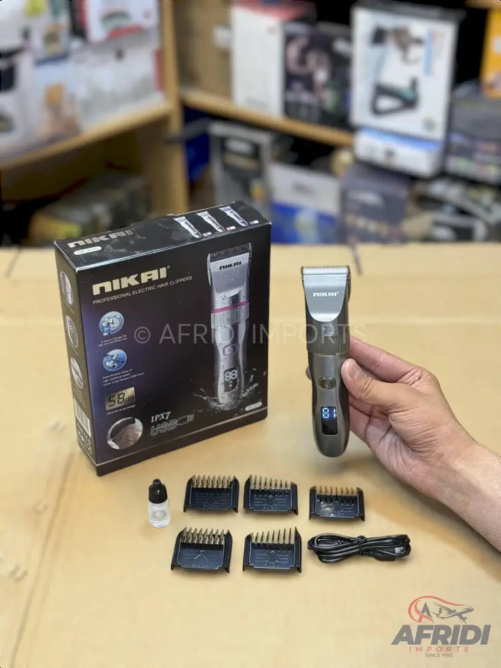 A NIKAI professional electric hair clipper kit with multiple guide combs, charging cable, and lubricating oil.