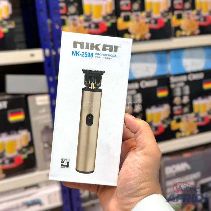 Gold professional hair trimmer in its white packaging.