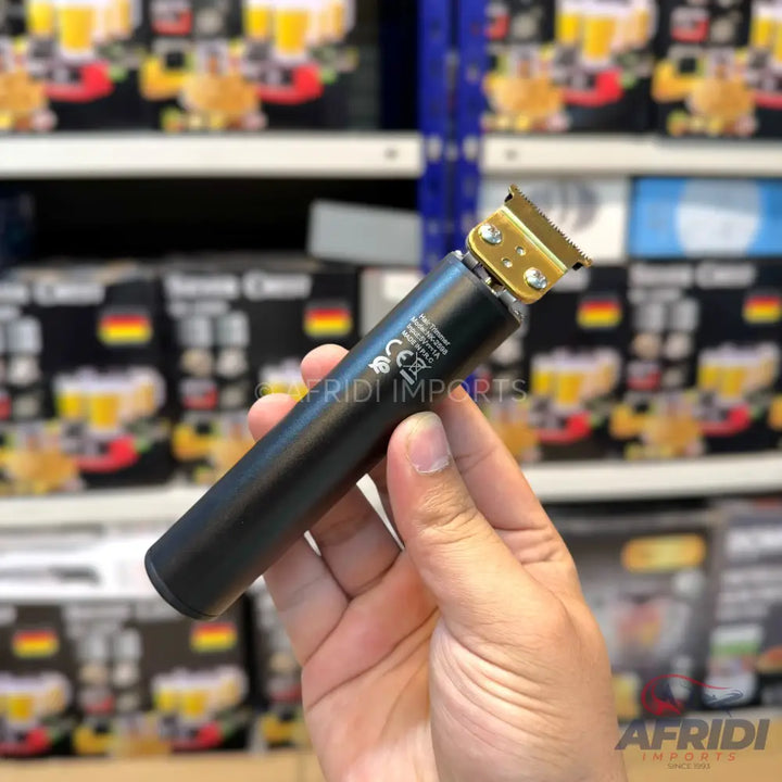 Black and gold cordless hair clipper.