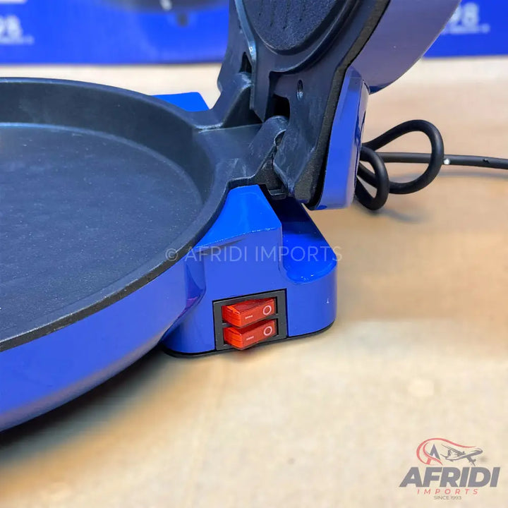 Blue electric crepe maker with two red rocker switches.