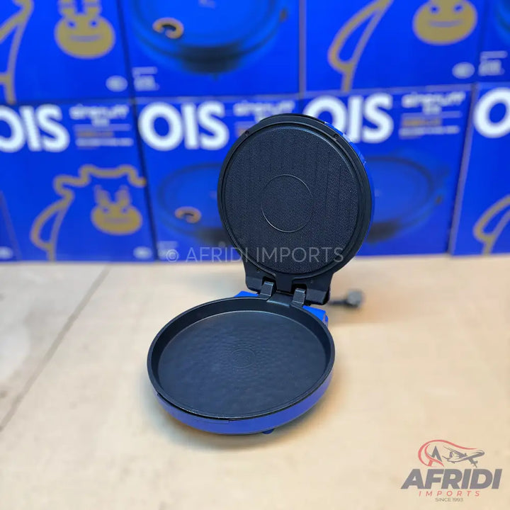 Open blue and black electric tortilla or roti maker.