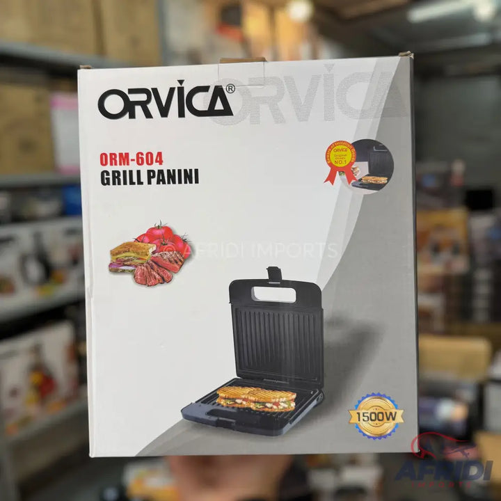 A boxed Orvica Grill Panini, model ORM-604, with a power rating of 1500W.