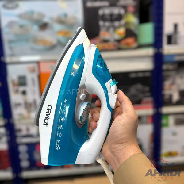 A blue and white steam iron with a textured grip.