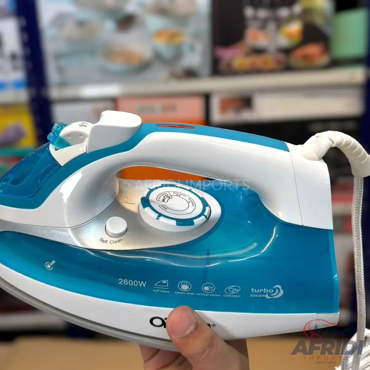 A blue and white steam iron with a ceramic soleplate and 2600W power, featuring a ’turbo’ steam function.
