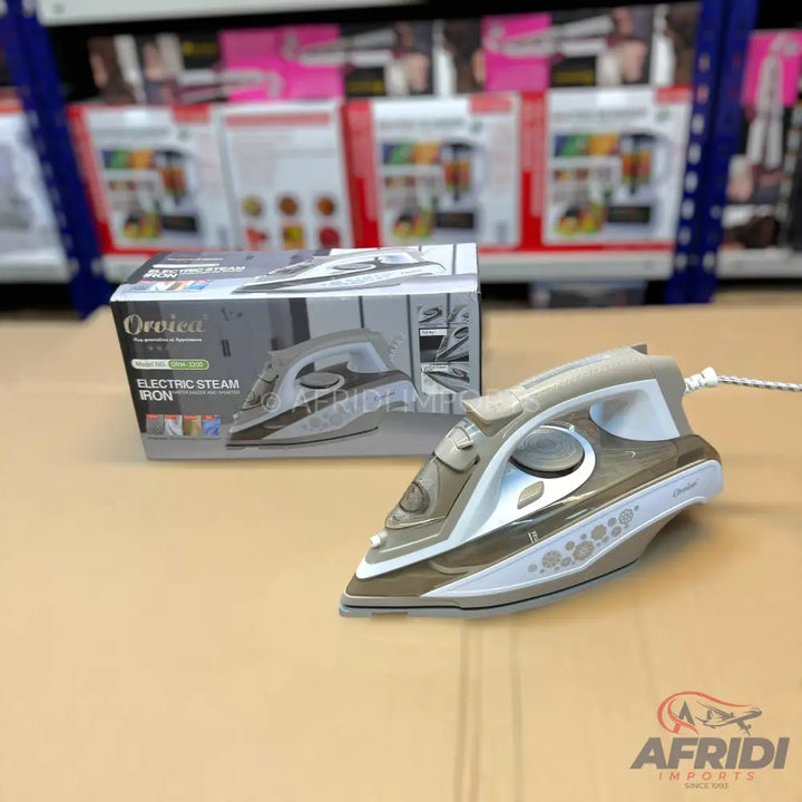 A brown and white electric steam iron with a floral design.