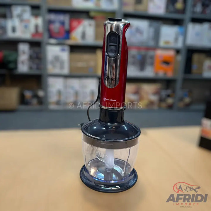 Red and black immersion blender with a clear chopping attachment.