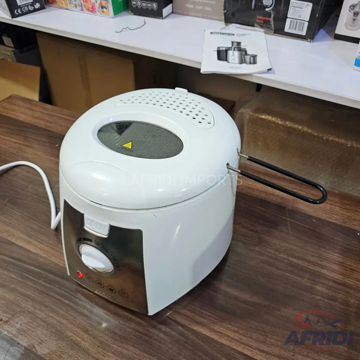 White deep fryer with a viewing window, temperature control knob, and a removable handle.