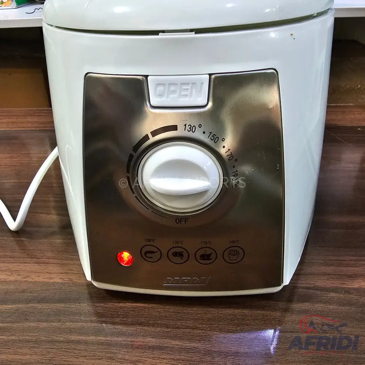 White electric deep fryer with a silver control panel, adjustable temperature settings, and indicator lights.
