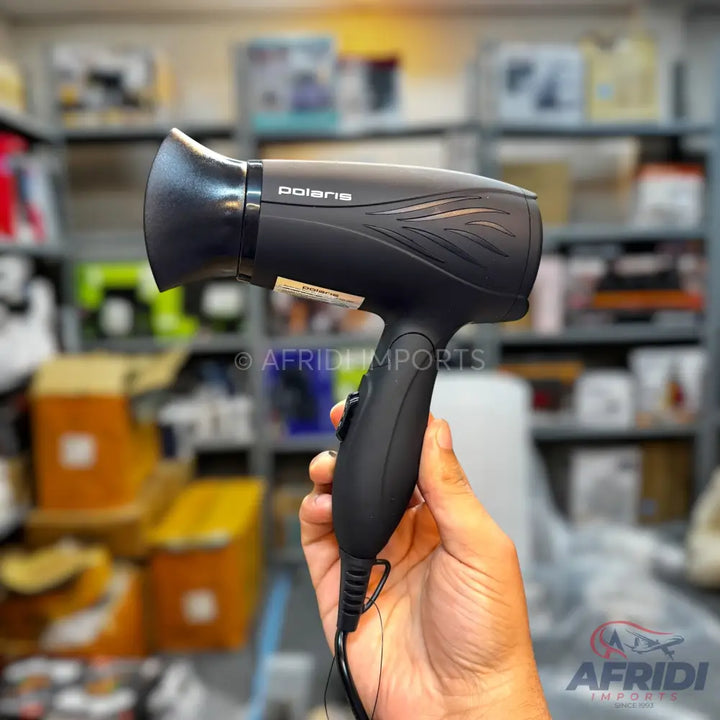 Black Polaris hair dryer with a textured grip.