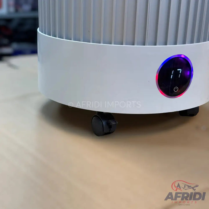 White cylindrical portable air cooler with an LED display showing ’17’’ and a power button.