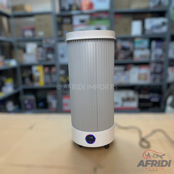 A tall, cylindrical, light-grey electric room heater with a white base and a blue-lit control dial.