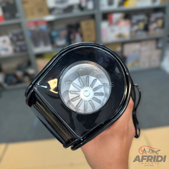 A black, handheld fan with a visible impeller.